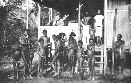 A group of native “boys” at Momi: These natives acted as carriers for Doctor Mayr on his journey from the interior back to the coast.