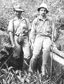 Doctor Mayr (right) with his Malay mantri: Arriving at Kofo, Anggi Lakes, after two months in the wild interior of New Guinea