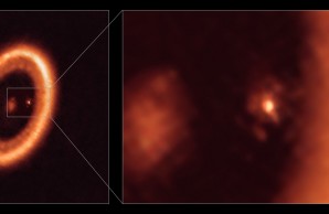 Orange ring against black universe with blow up of bright orange spot suspended inside donut.